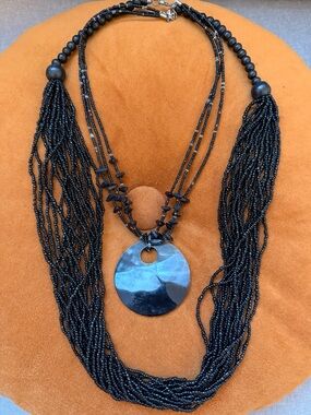 Two Black Multi-Strand Beaded Necklace with Round Pendant